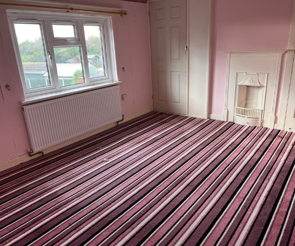 Empty and tidy bedroom after Morris Movers completed a full house clearance in Thanet.